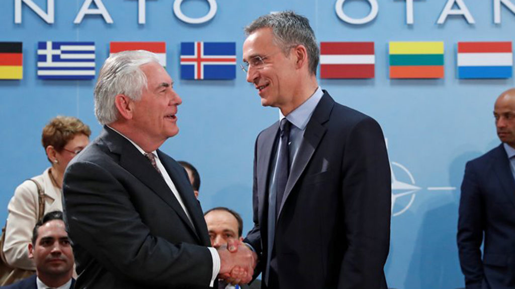 U.S. Secretary of State Rex Tillerson (L) shakes hands with NATO Secretary General Jens Stoltenberg during a NATO foreign ministers meeting at the Alliance's headquarters in Brussels, Belgium March 31, 2017. REUTERS/Yves Herman